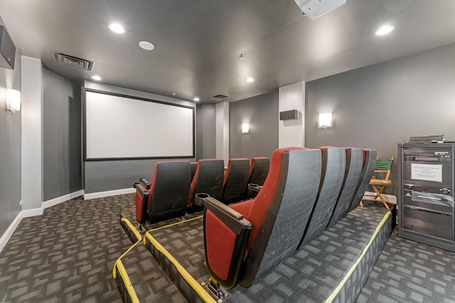 carpeted cinema room featuring baseboards, visible vents, and recessed lighting