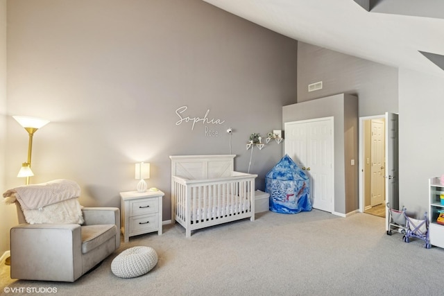 carpeted bedroom with high vaulted ceiling and baseboards