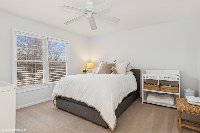 bedroom with baseboards, carpet, and ceiling fan