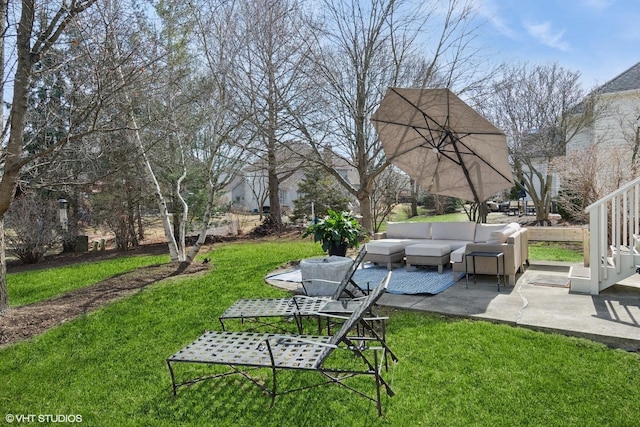 view of yard with outdoor lounge area and a patio