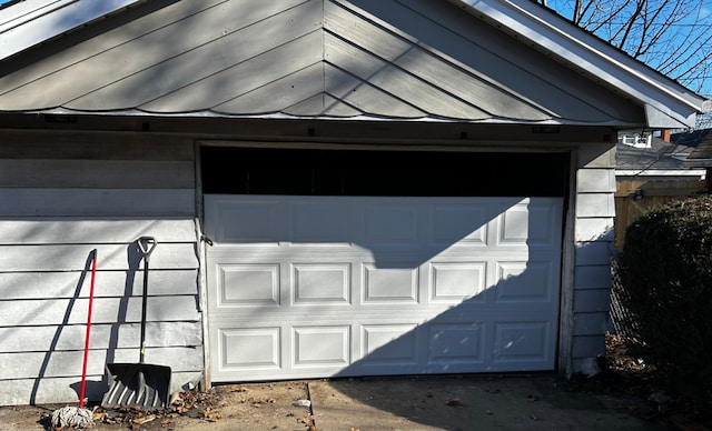 view of side of home featuring a garage