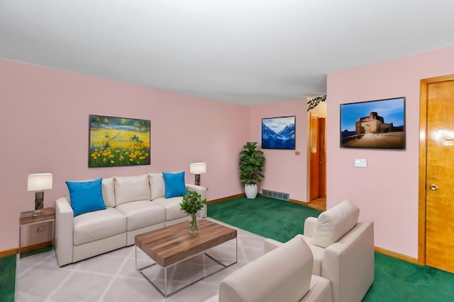 living room with carpet floors, visible vents, and baseboards