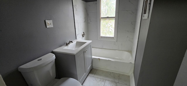 full bathroom with marble finish floor, a bathing tub, vanity, and toilet