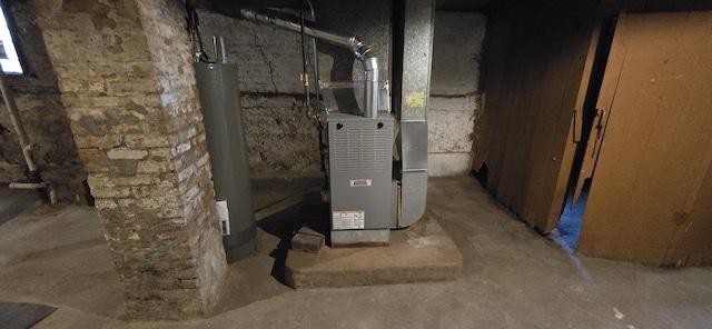 utility room with water heater and heating unit