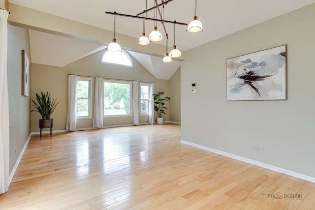 621 Raintree Rd, Buffalo Grove, IL 60089 - unfurnished room with light wood-type flooring and vaulted ceiling
