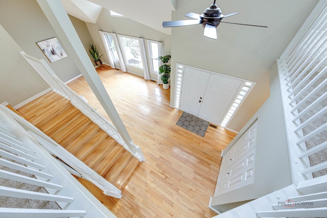 621 Raintree Rd, Buffalo Grove, IL 60089 - foyer entrance featuring stairs, wood finished floors, a ceiling fan, and a towering ceiling