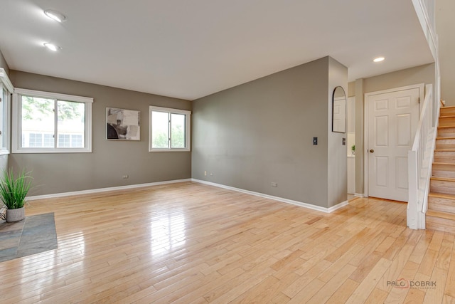 621 Raintree Rd, Buffalo Grove, IL 60089 - unfurnished room featuring stairs, light wood-style flooring, and recessed lighting