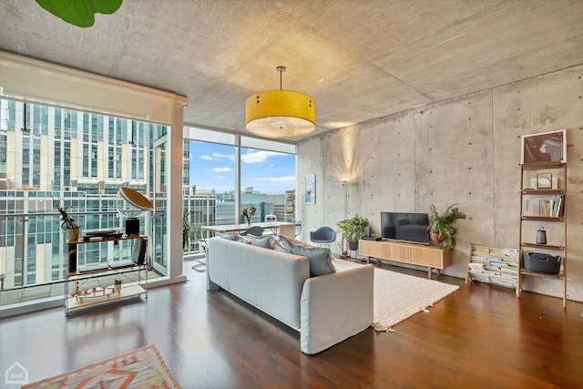 living area featuring wood finished floors and floor to ceiling windows