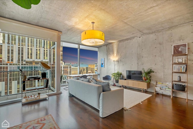 living room featuring expansive windows and wood finished floors