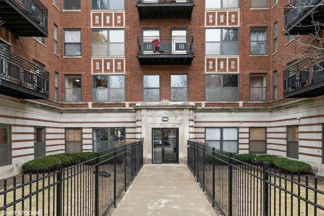 view of building exterior with fence