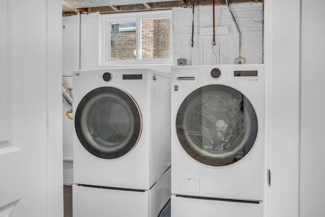 washroom featuring laundry area and washer and dryer