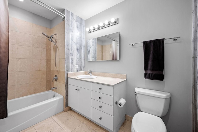 bathroom featuring shower / tub combo with curtain, vanity, toilet, and tile patterned floors