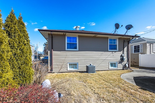 back of house with a patio, fence, a lawn, and central AC