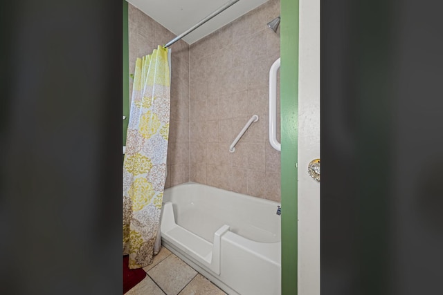 full bathroom featuring tile patterned floors and shower / bath combo with shower curtain