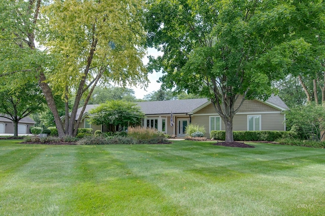 ranch-style home with a front lawn