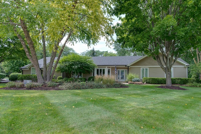 ranch-style home with a front lawn