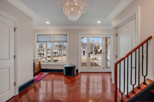 entrance foyer with crown molding, recessed lighting, stairway, a chandelier, and wallpapered walls