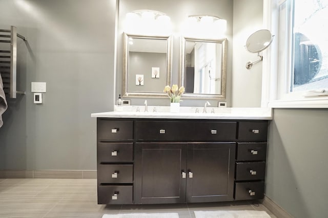 bathroom featuring vanity and baseboards