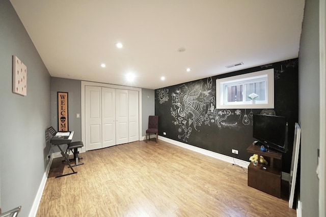 interior space featuring recessed lighting, visible vents, baseboards, and wood finished floors