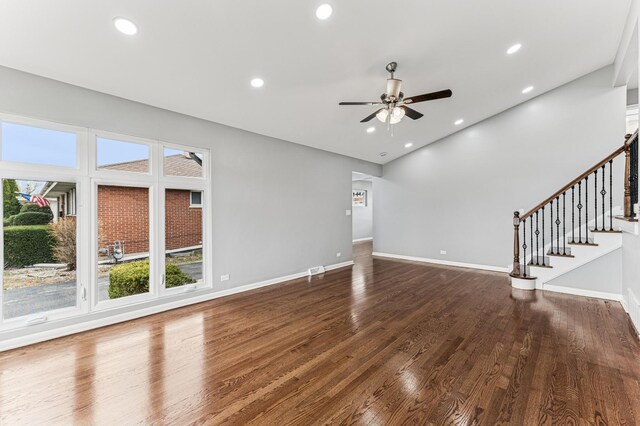 unfurnished living room featuring ceiling fan, recessed lighting, wood finished floors, and baseboards