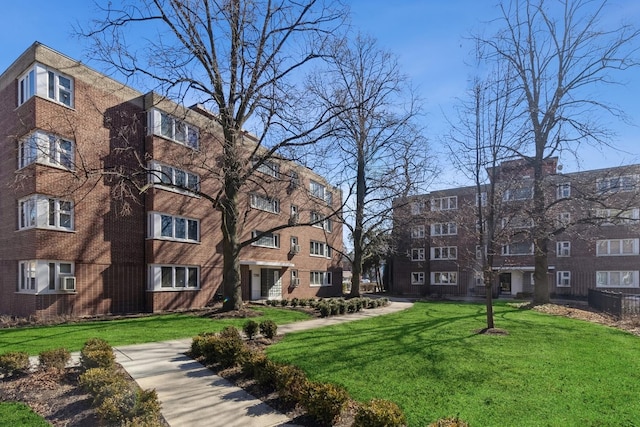 view of property's community with a yard