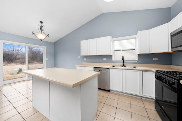 kitchen featuring light tile patterned flooring, a sink, white cabinetry, light countertops, and appliances with stainless steel finishes