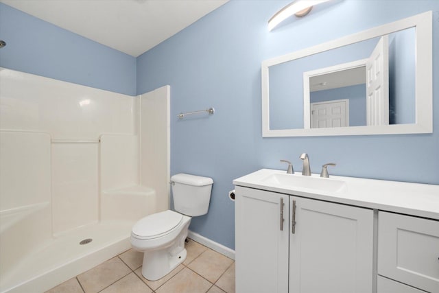 full bathroom featuring a shower, vanity, toilet, and tile patterned floors