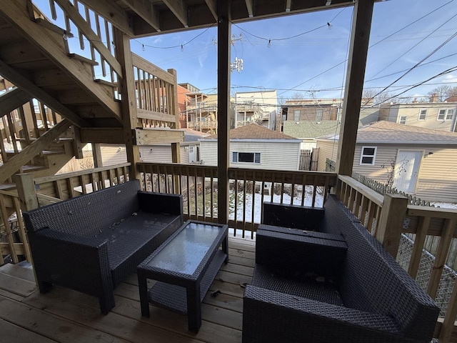 wooden deck with an outdoor living space and a residential view