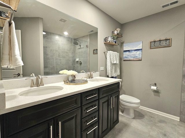 full bathroom with visible vents, a sink, a shower stall, and toilet