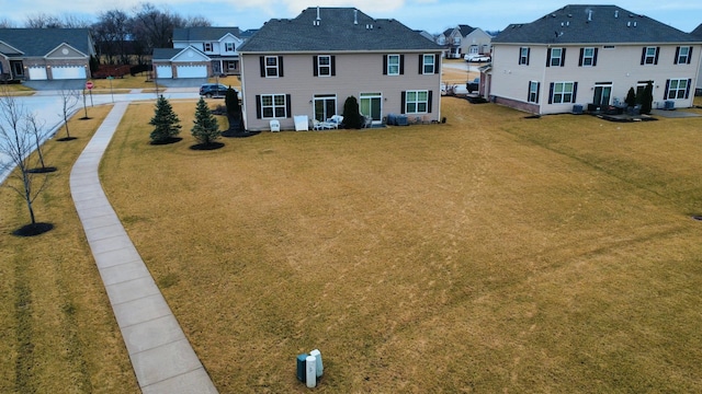 birds eye view of property with a residential view