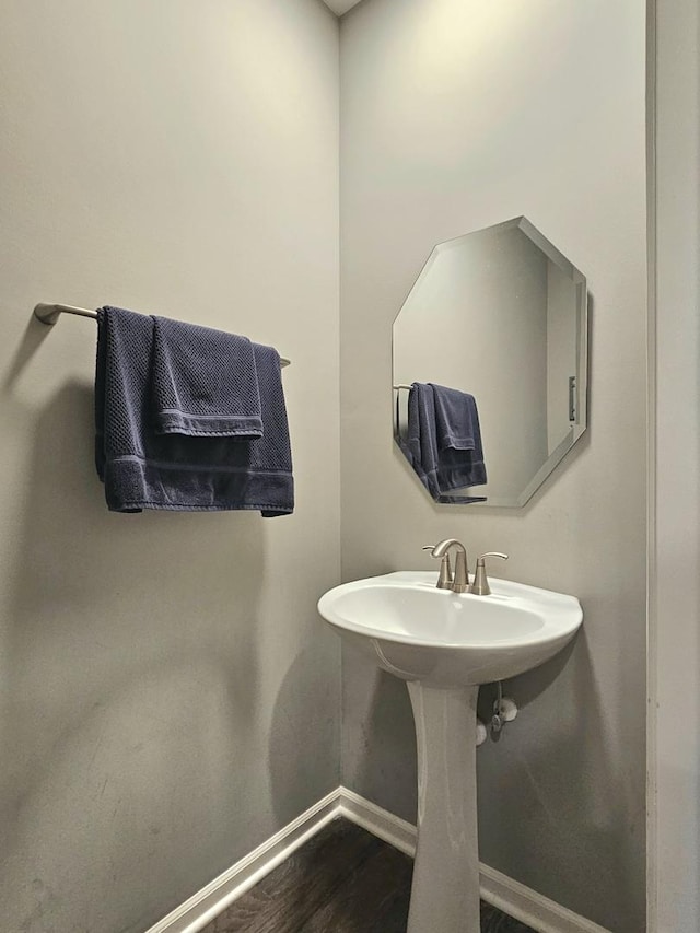 bathroom featuring baseboards and wood finished floors