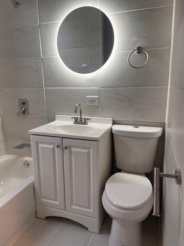 full bathroom featuring shower / tub combination, toilet, vanity, tile walls, and backsplash