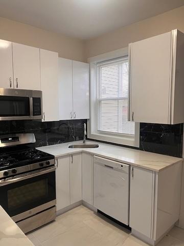 kitchen with a sink, white cabinetry, light countertops, appliances with stainless steel finishes, and decorative backsplash