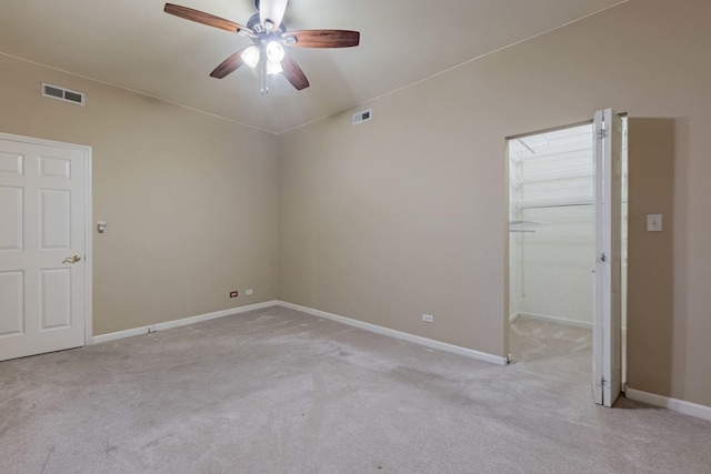 unfurnished room featuring light carpet, visible vents, and baseboards