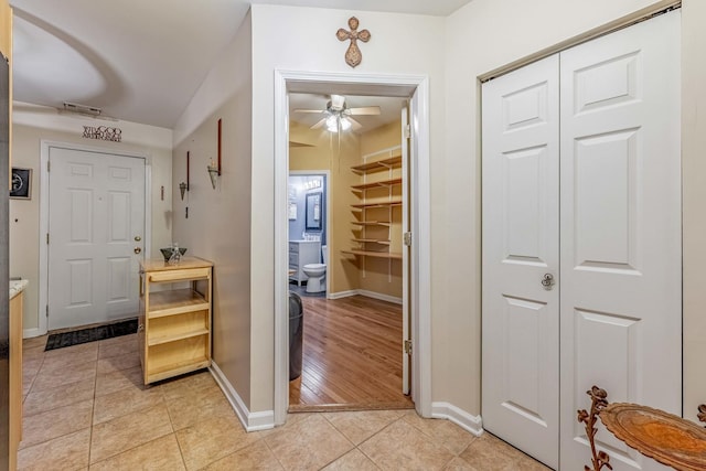 interior space featuring visible vents, baseboards, and light tile patterned floors