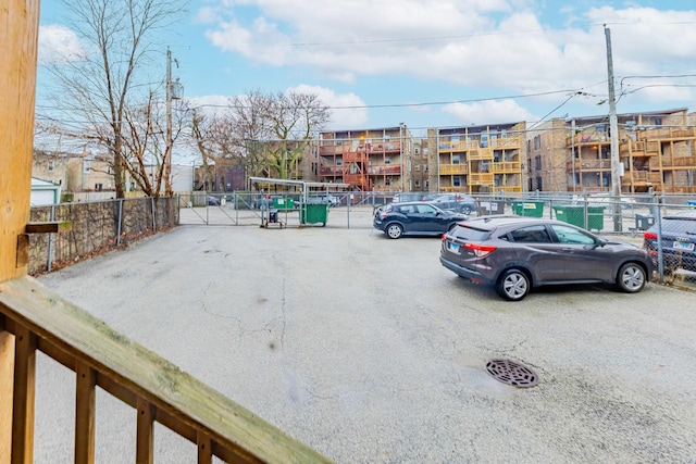 uncovered parking lot with fence