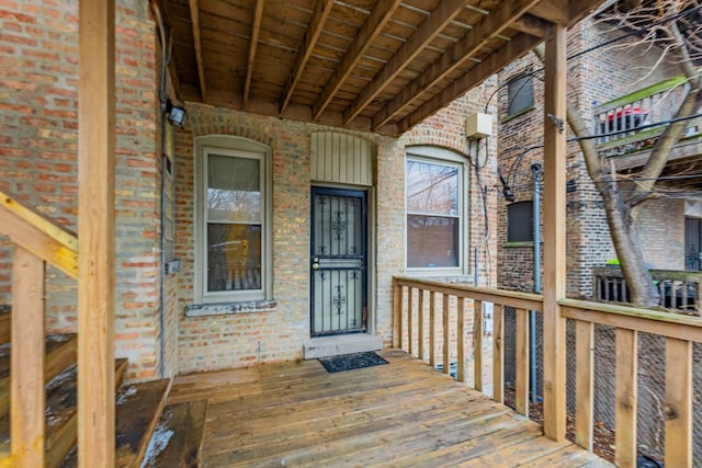 property entrance with brick siding