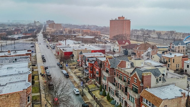 birds eye view of property featuring a city view