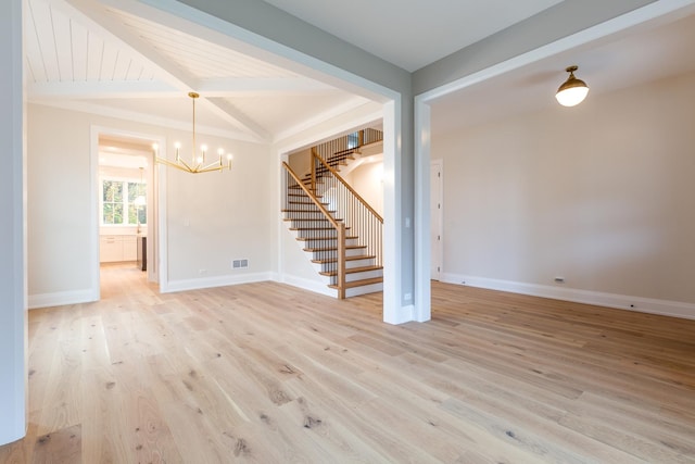 spare room featuring baseboards, visible vents, stairway, an inviting chandelier, and light wood-type flooring