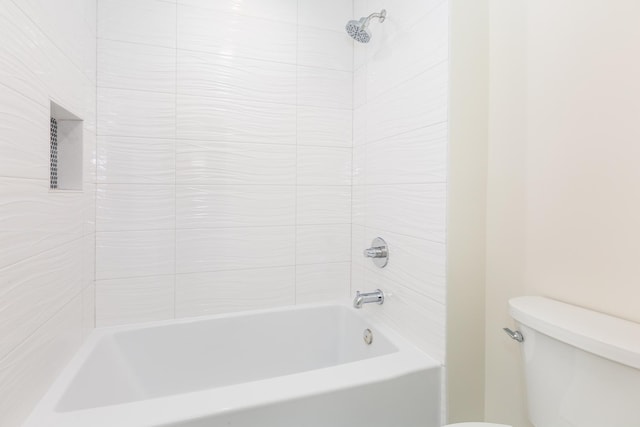 bathroom with shower / bathtub combination and toilet