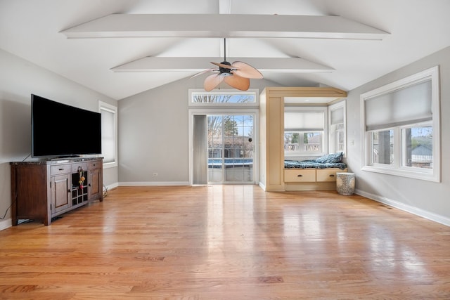 unfurnished living room with light wood-type flooring, a ceiling fan, and baseboards