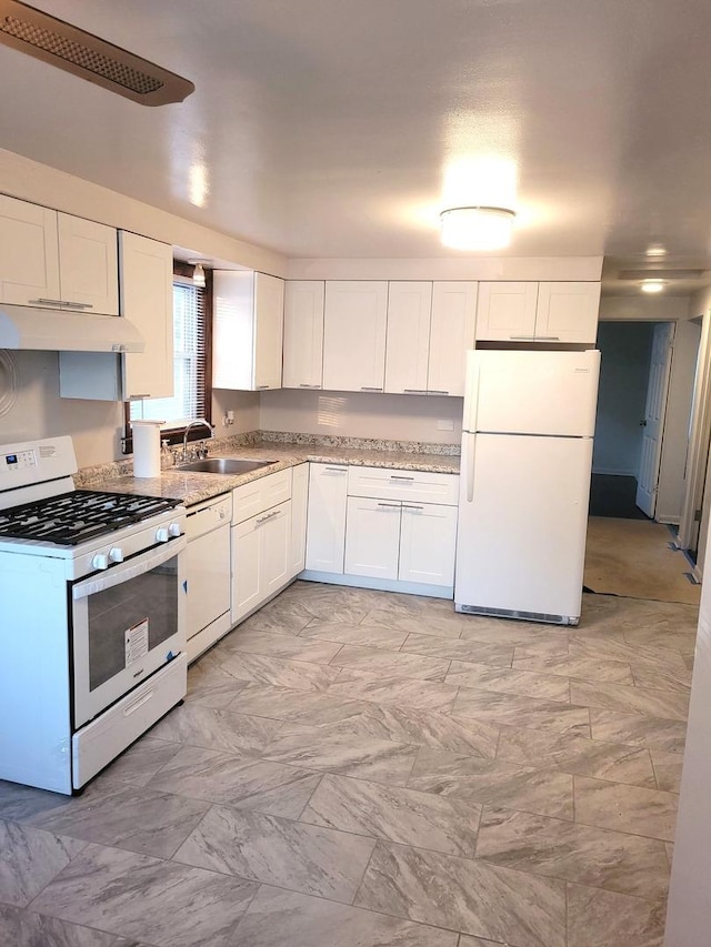 kitchen featuring light stone counters, under cabinet range hood, white appliances, a sink, and white cabinets