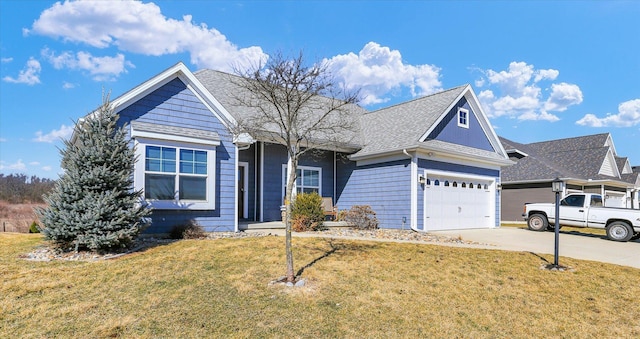 view of front of home with a garage, concrete driveway, a shingled roof, and a front yard