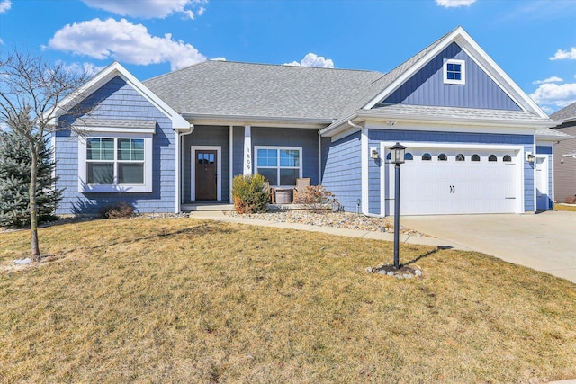 single story home featuring driveway, a garage, a front lawn, and roof with shingles