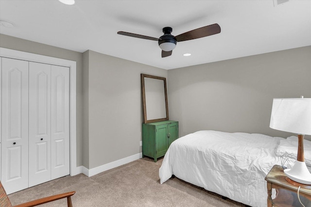 bedroom featuring recessed lighting, a closet, light carpet, ceiling fan, and baseboards
