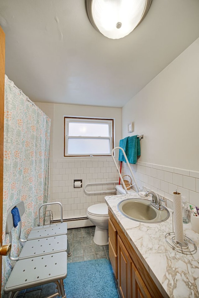 full bath with a shower with curtain, tile walls, toilet, and vanity