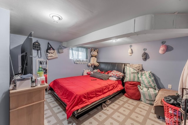 bedroom featuring light floors