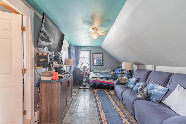 bedroom featuring lofted ceiling, ceiling fan, and wood finished floors