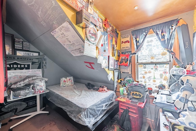 bedroom featuring lofted ceiling