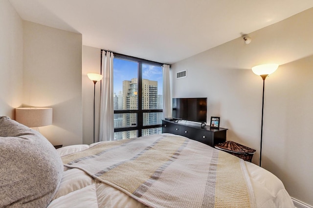 bedroom featuring visible vents